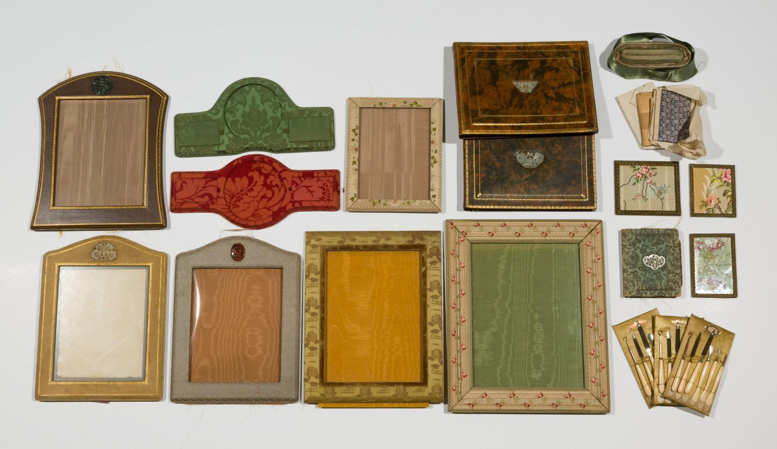 Collection of Items Manufactured 1930's New York incl. Unused Chinese Silk Ribbon: DESCRIPTION: Also includes three bone handled manicure sets, silk covered picture frames, photo albums, and silk covered desktop organizers. All various colors and patterns. All from circa 1930s. Some