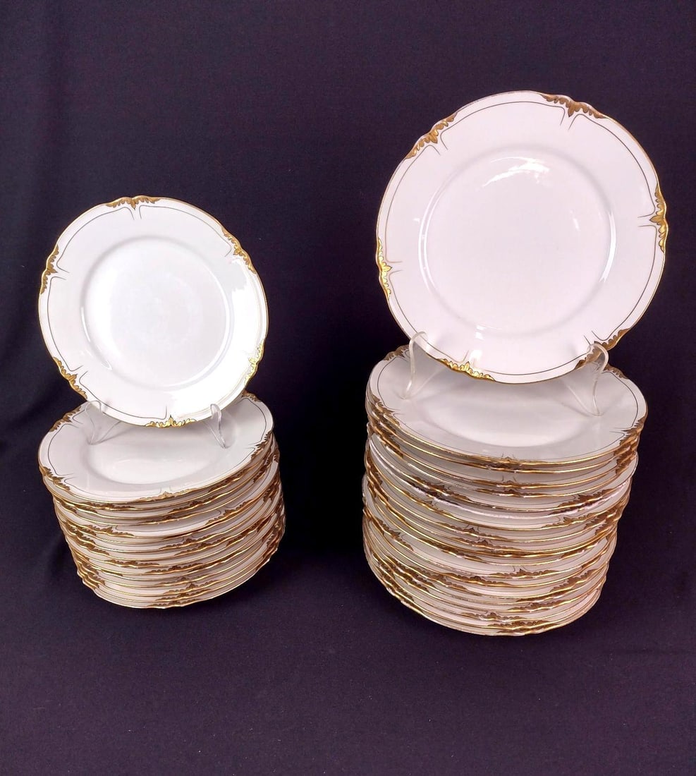 36 Limoges Plates with Gold Rim: Includes 16 salad plates and 20 dinner plates. 9" to 9-3/4" diameter. Some losses to gold paint.