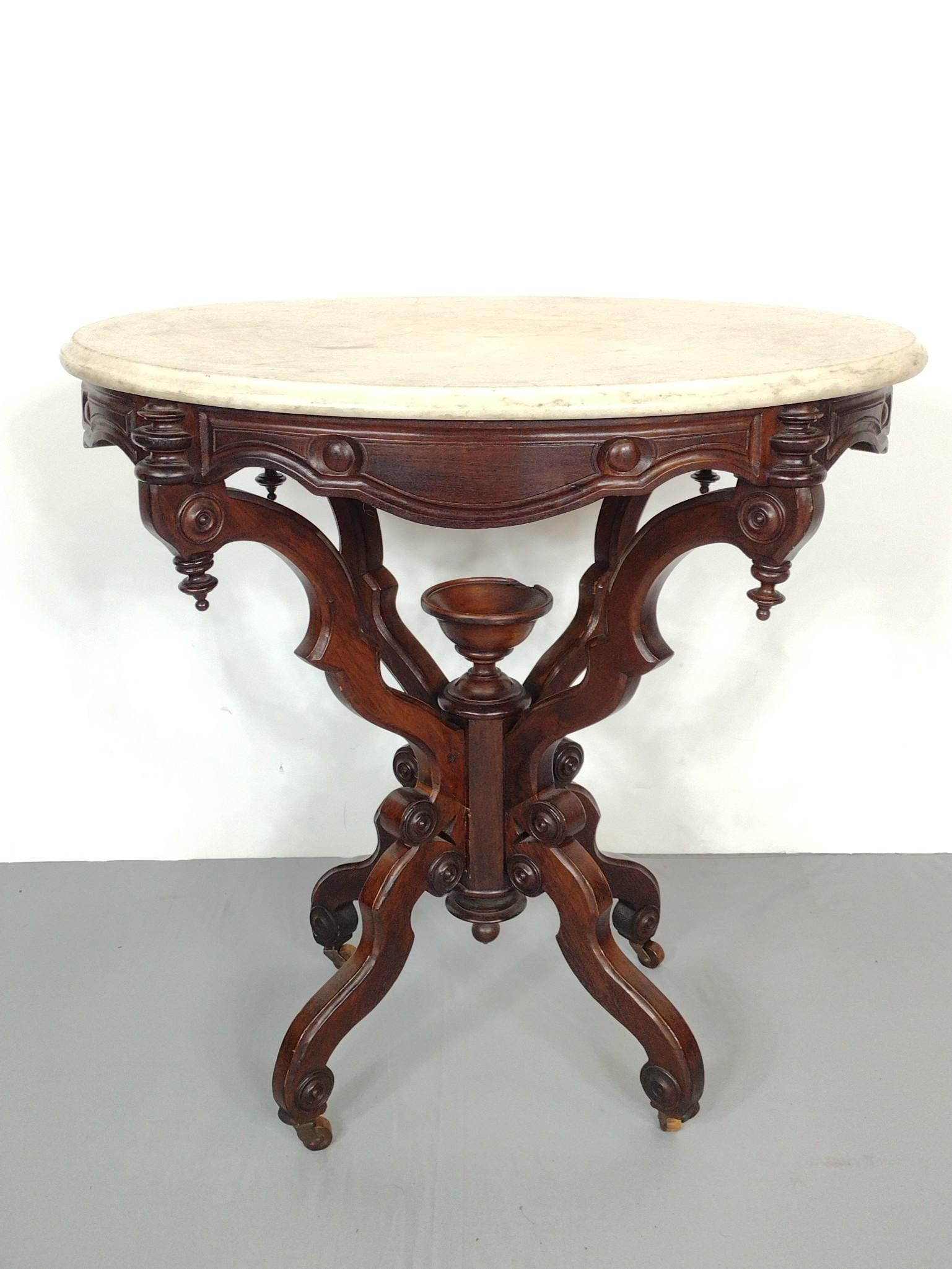 Victorian Marble Top Table: 21-1/2" wide X 29" deep X 29-1/2" high. Marble Top has some discoloring. Minor wood loss to center. MG.