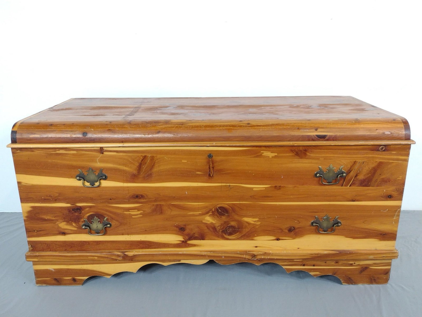 Cedar Chest: 46-1/2" wide X 20-1/4" deep X 21-1/2" high. Has scratches. MG.