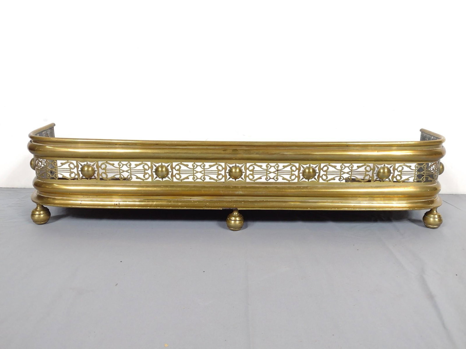 Brass Fire Fender: 43" wide X 10" deep X 9' high. Has some discoloring. MG.