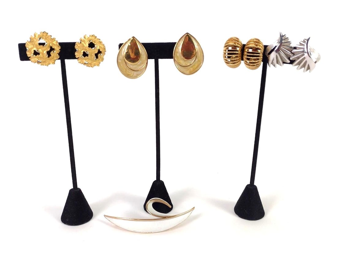 9 Pcs Trifari and Monet Jewelry: Includes clip on earrings and a brooch. 1" to 3-1/2" long. LR