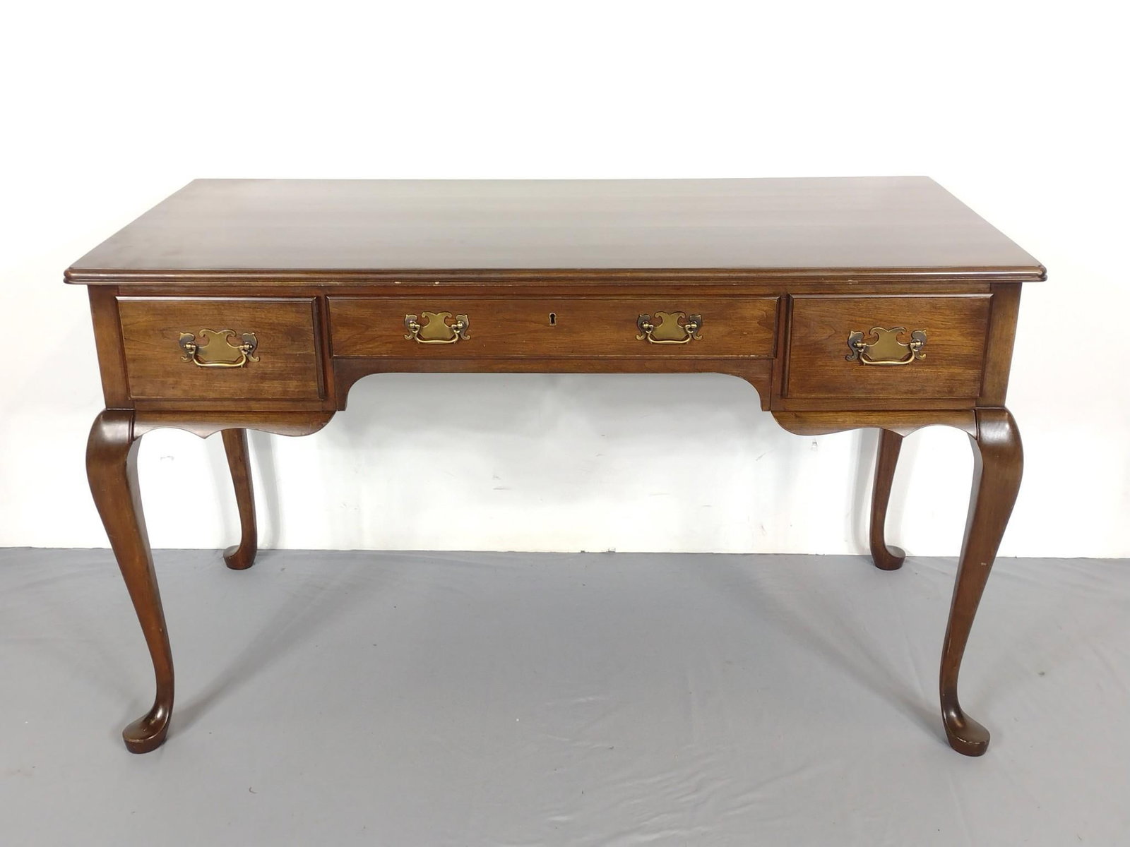 Pennsylvania House Desk: 50" wide X 24" deep X 29-1/2" high. Has some light scratches. MG.