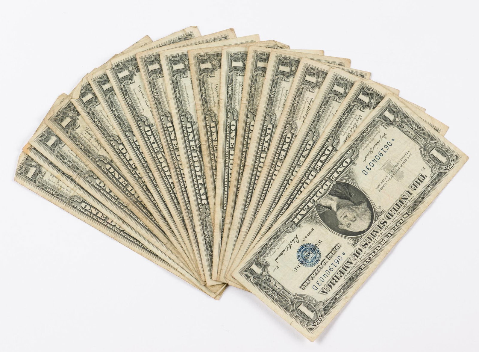 19 1957 $1 Bills Including Star Note: Includes 1957 star note, (4) 1957, (6) 1957-A, and (6) 1957-B. Good-Average. AJ.