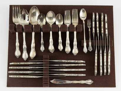 55 Pcs. Gorham Sterling Flatware Service Incl. Serving Pieces: Gorham Rose Tiara pattern. Includes (7) 6-3/4" forks, (8) 7-3/8" forks, (8) 6" spoons, (8) 6-1/2" spoons, (8) 6-3/8" knives, (8) 8-3/4" knives, (3) 8-1/2" serving spoons, (1) 8-1/2" serving fork, (1)