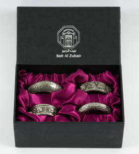 4 Sterling Bait Al Zubair Napkin Rings: Four ornate sterling napkin rings from Bait Al Zubair gift shop, in original box. Not marked. 5.64 ozt total. 1-3/4" diameter. Tarnishing consistent with use and age. MEG