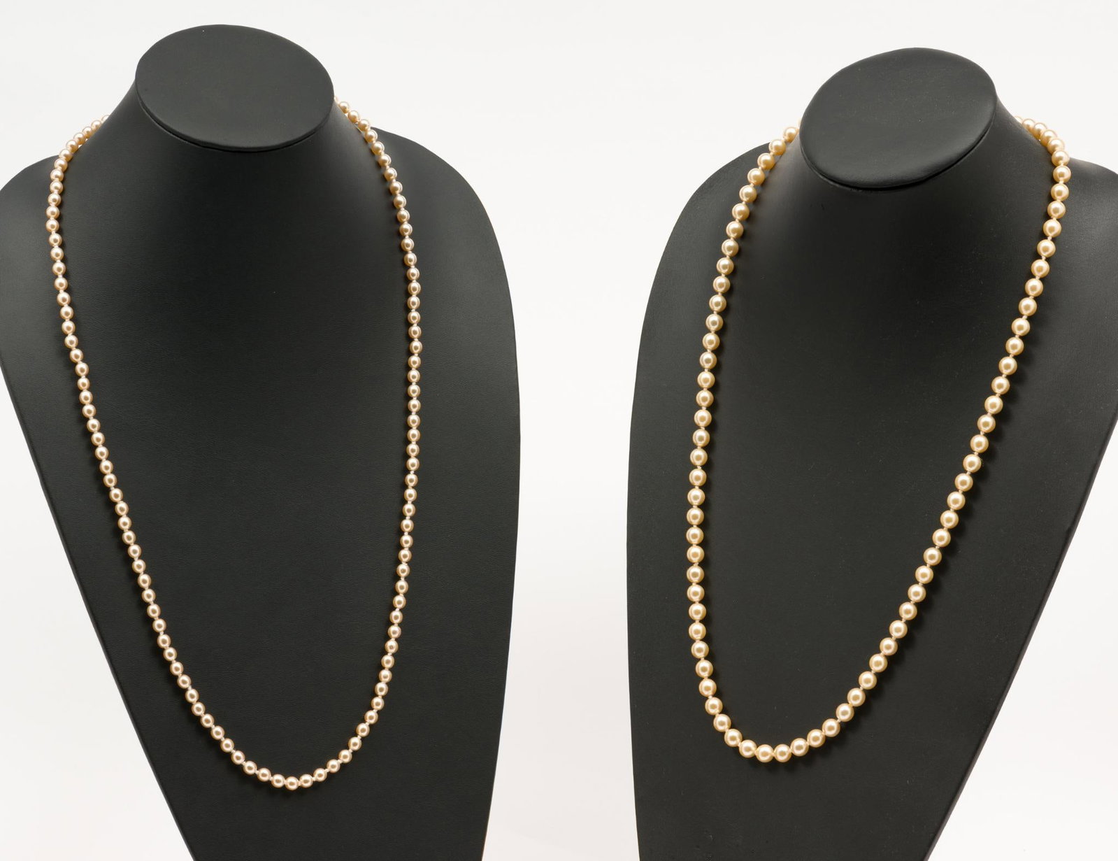2 Nolan Miller Glamour Collection Necklaces: 2 faux pearl necklaces by the Nolan Miller Glamour Collection. 29" and 31" long. AJ.
