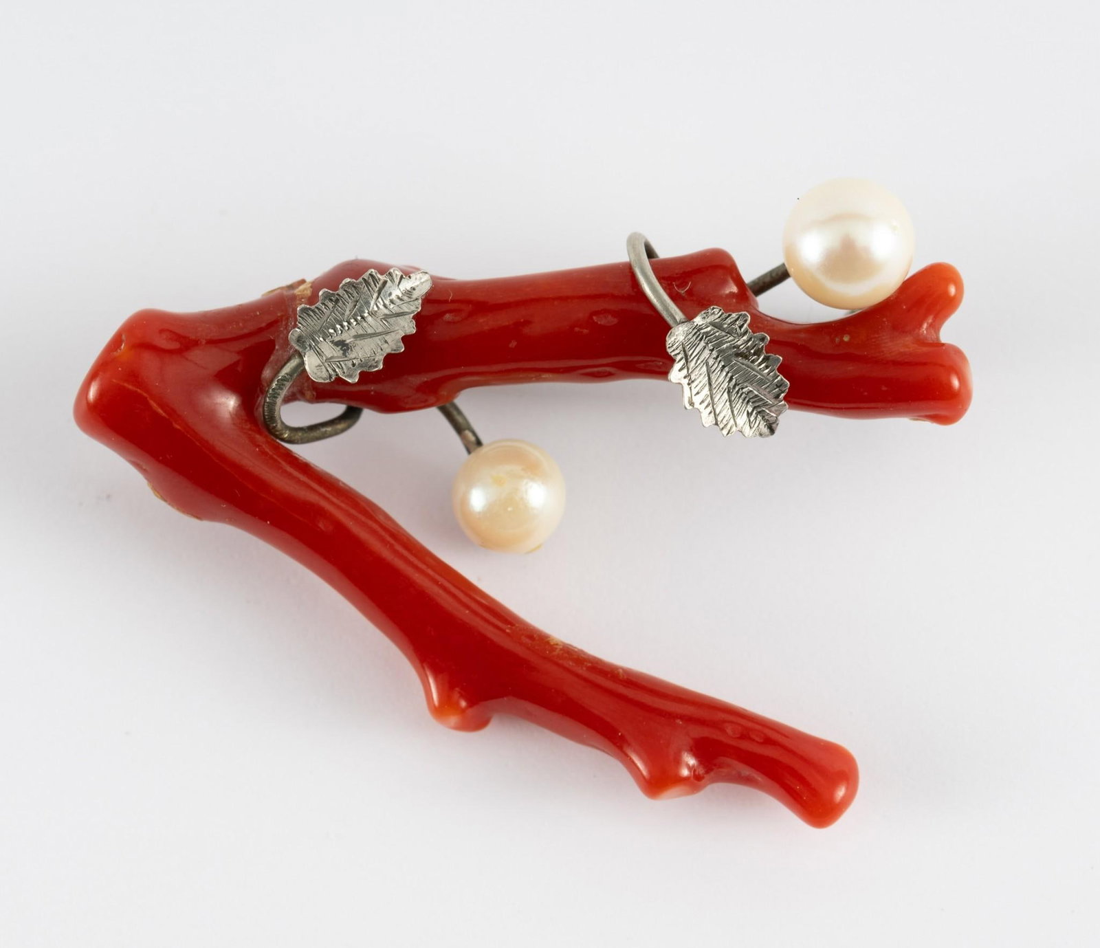 Coral And Pearl Branch Pin: Sterling pin with coral branch and pearls. 1-1/2" wide x 1" high. Pearl diameter 1/4". AJ.