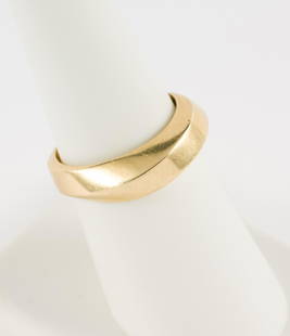 Tiffany 18K Gold Band Ring: Tiffany 18K gold band ring. Marked Tiffany & Co. 750. 1/4" wide. Size 7. 6.7 grams. No condition issues. MEG