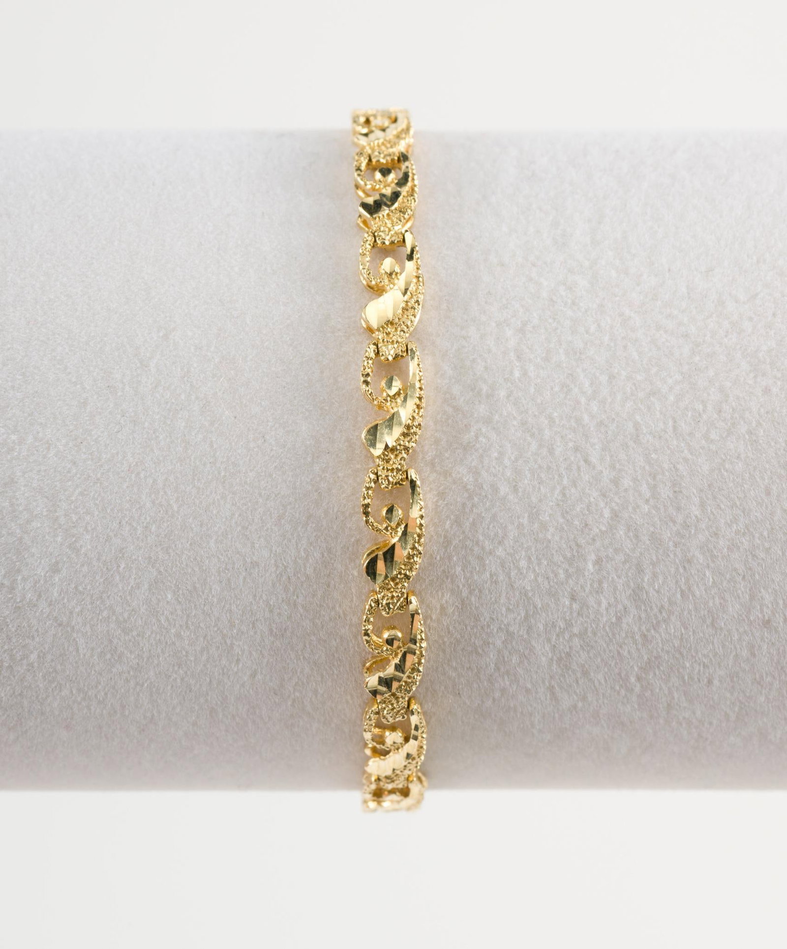 14k Gold Bracelet: 14k Gold Bracelet With Designer Links, Safety Lock at Clasp. Length 7". Weight 8.1 Grams