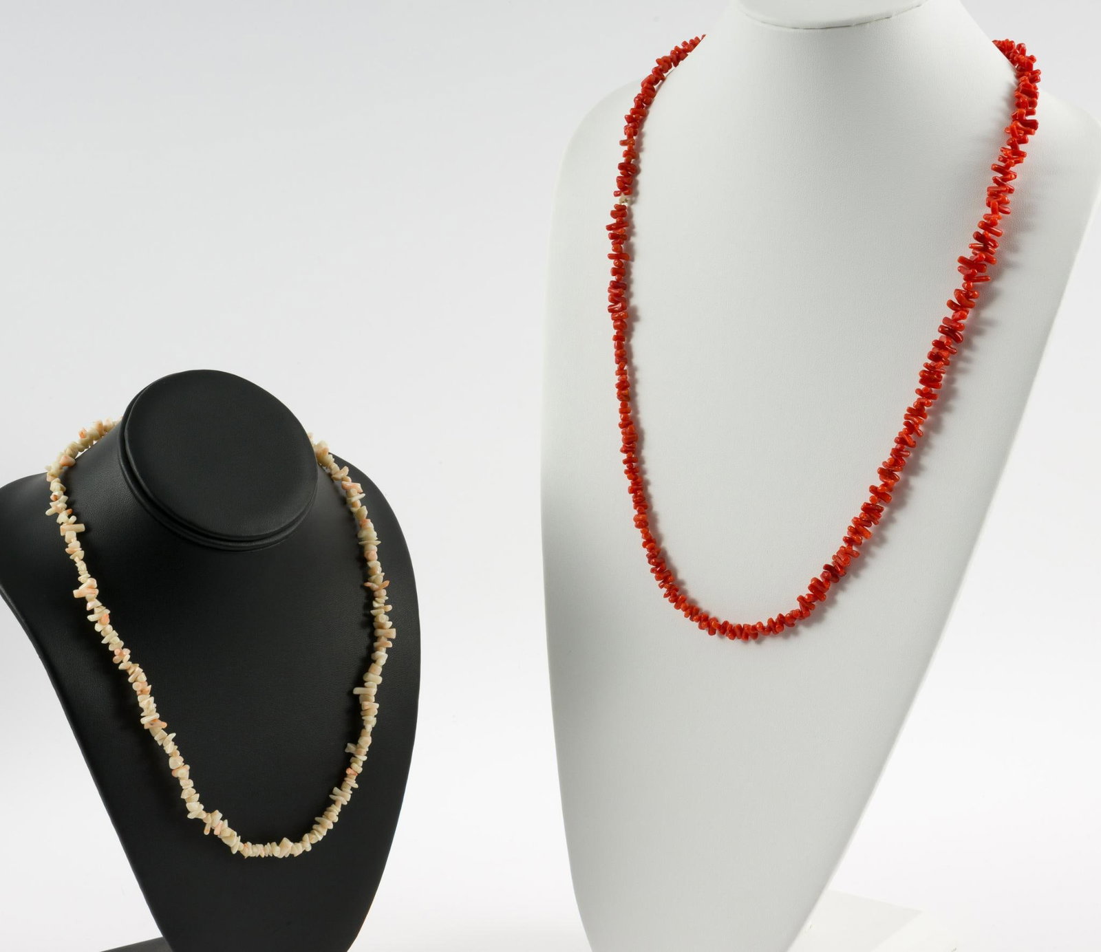 2 Coral Necklaces: Red and angel skin coral necklaces. 1/2" wide x 14-1/4" to 20" long. No condition issues. MEG