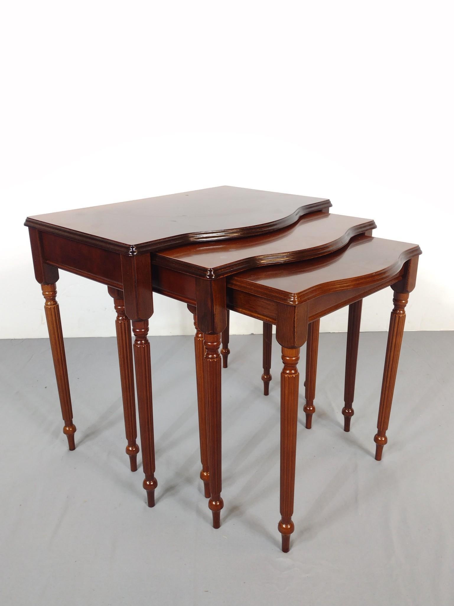 3 Nesting Tables: 15" to 22" wide X 10-1/2" to 15" deep X 18-3/4" to 20" high. All have some light scratches. No manufactures name found. MG.