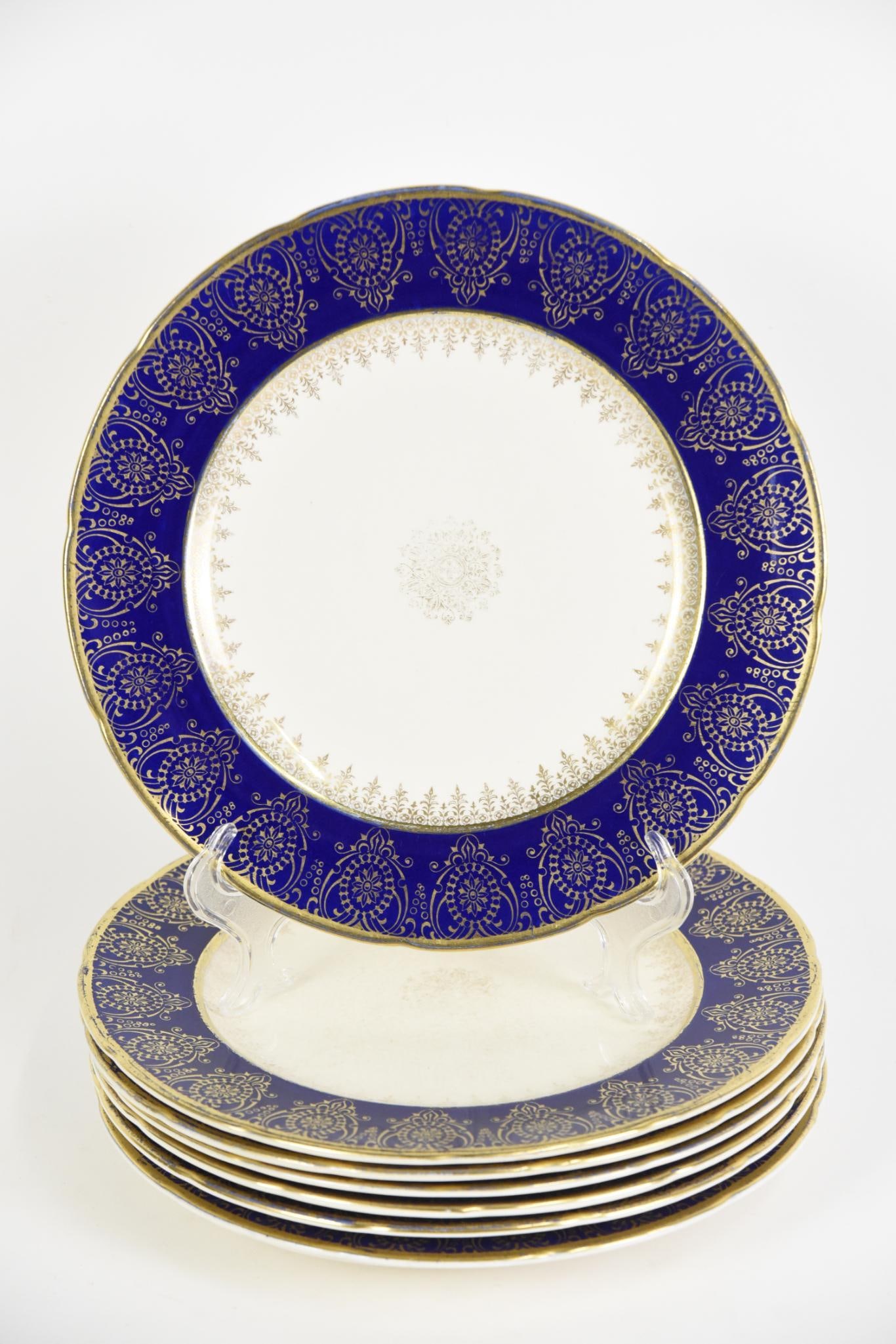 7 Cobalt and Gold Dinner Plates: Sovereign Canada. Each 11" diameter. Some discoloration and crazing. LR