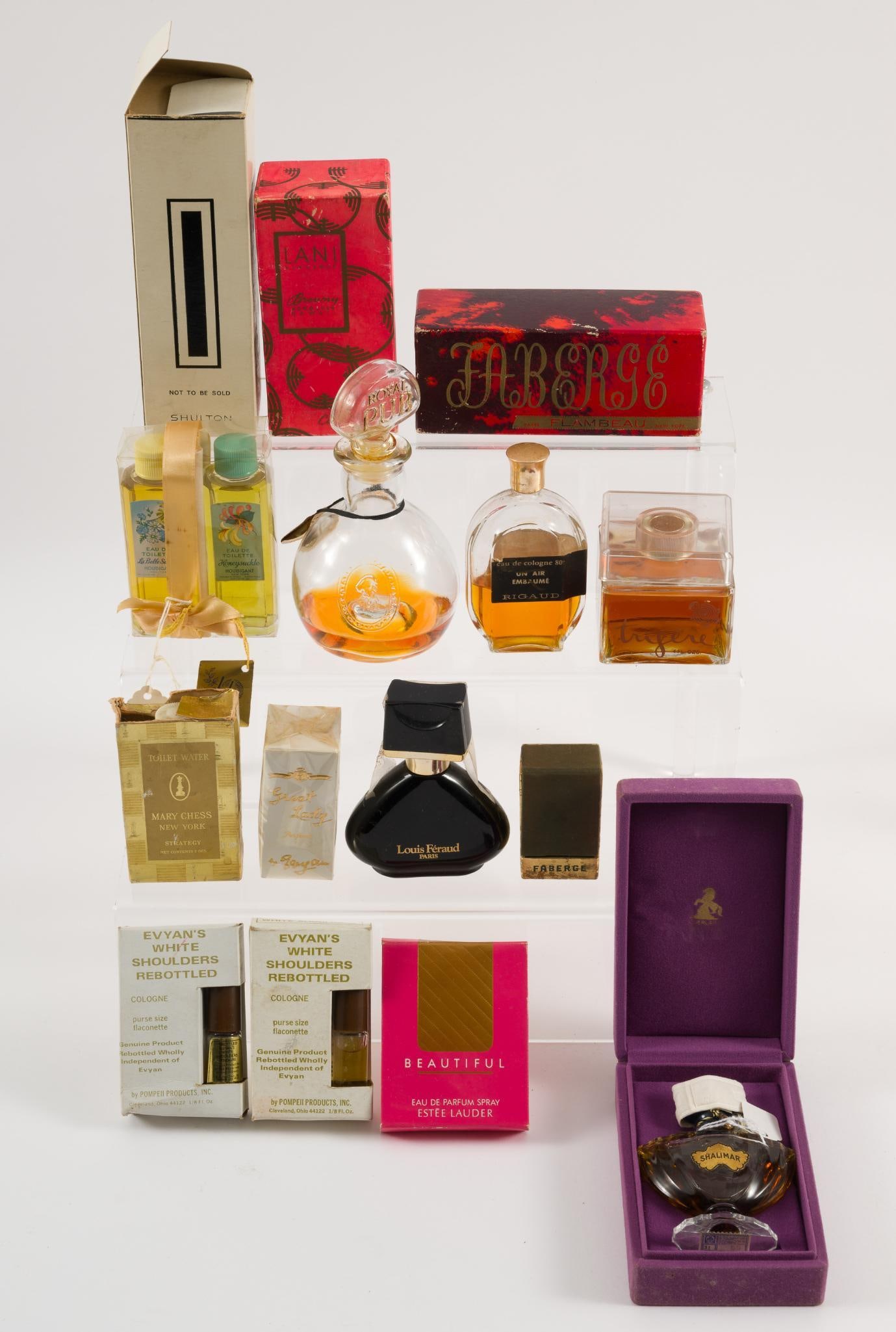 15 Pieces of Perfume: Includes: Shalimar, Faberge, Lani, Royal Lion Cologne, and more. 1-/2" to 2-1/4" wide x 2-1/2" to 6-3/4" high. JS