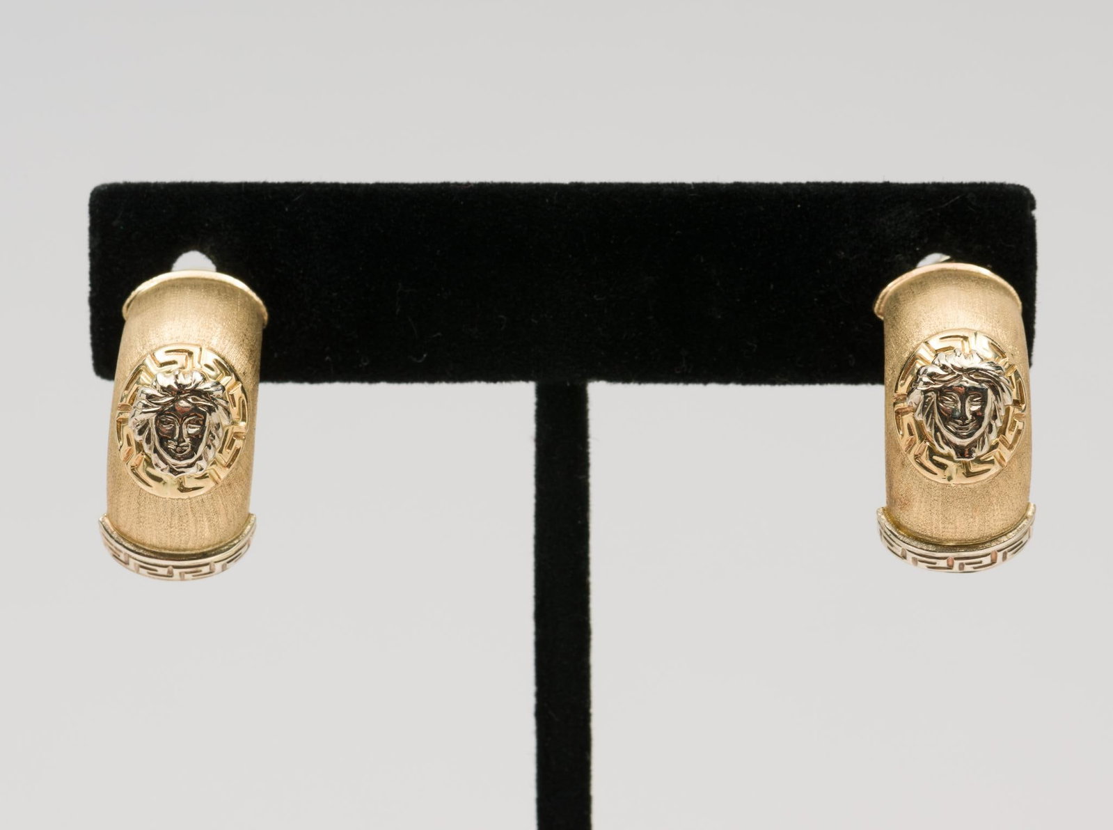14K Gold Hoop Earrings: Marked 14K Italy with figure and Greek Key border. Pierced Omega backs. 7/8" high. 10.9 grams. JS