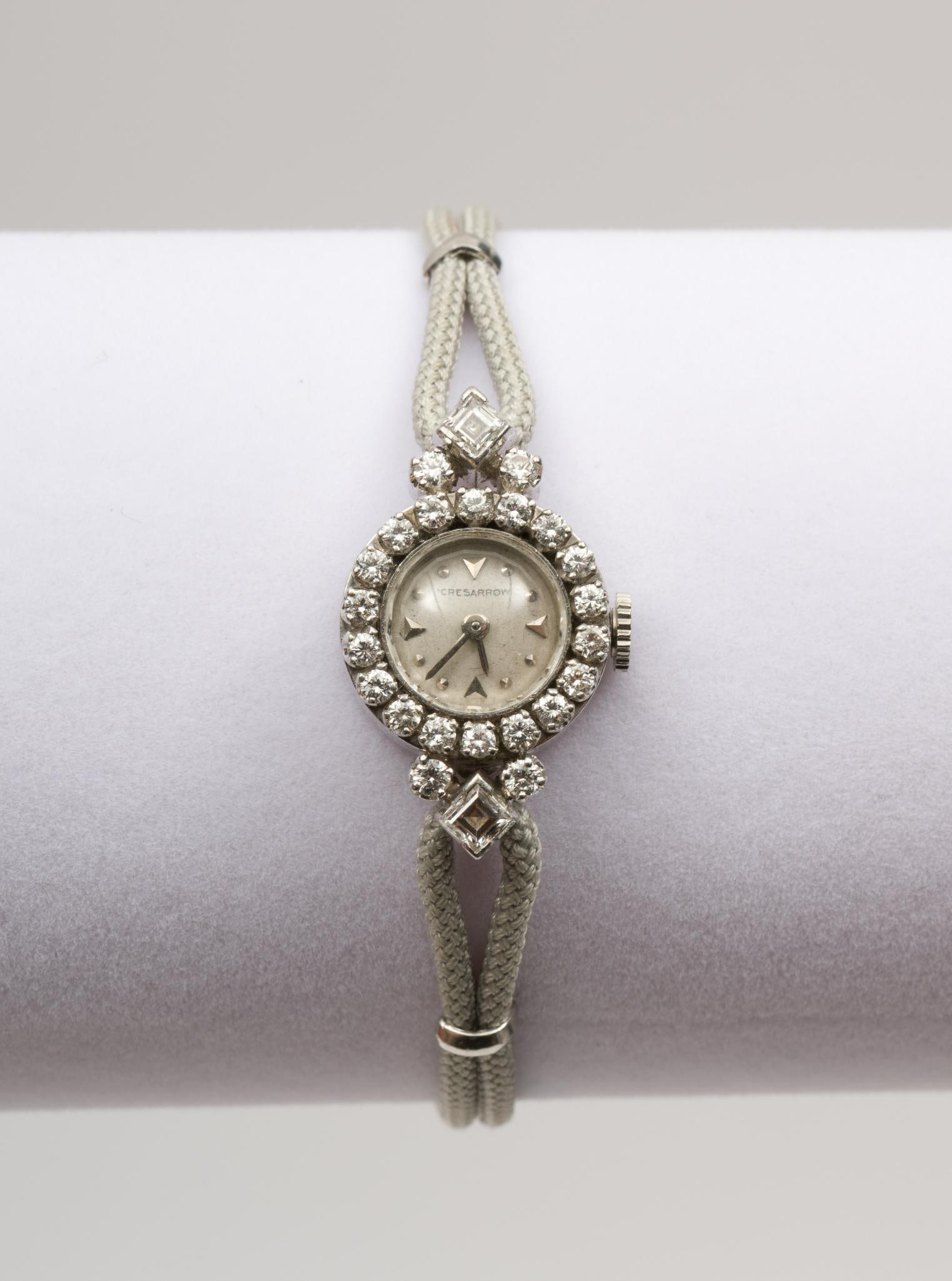 Platinum and Diamond Ladies Wrist Watch: Cresarrow 17 jewels movement. Works. In platinum case with 2 princess cut and 22 round single cut diamonds. Watch Case 1" x 3/4". Band is 6" long. JS