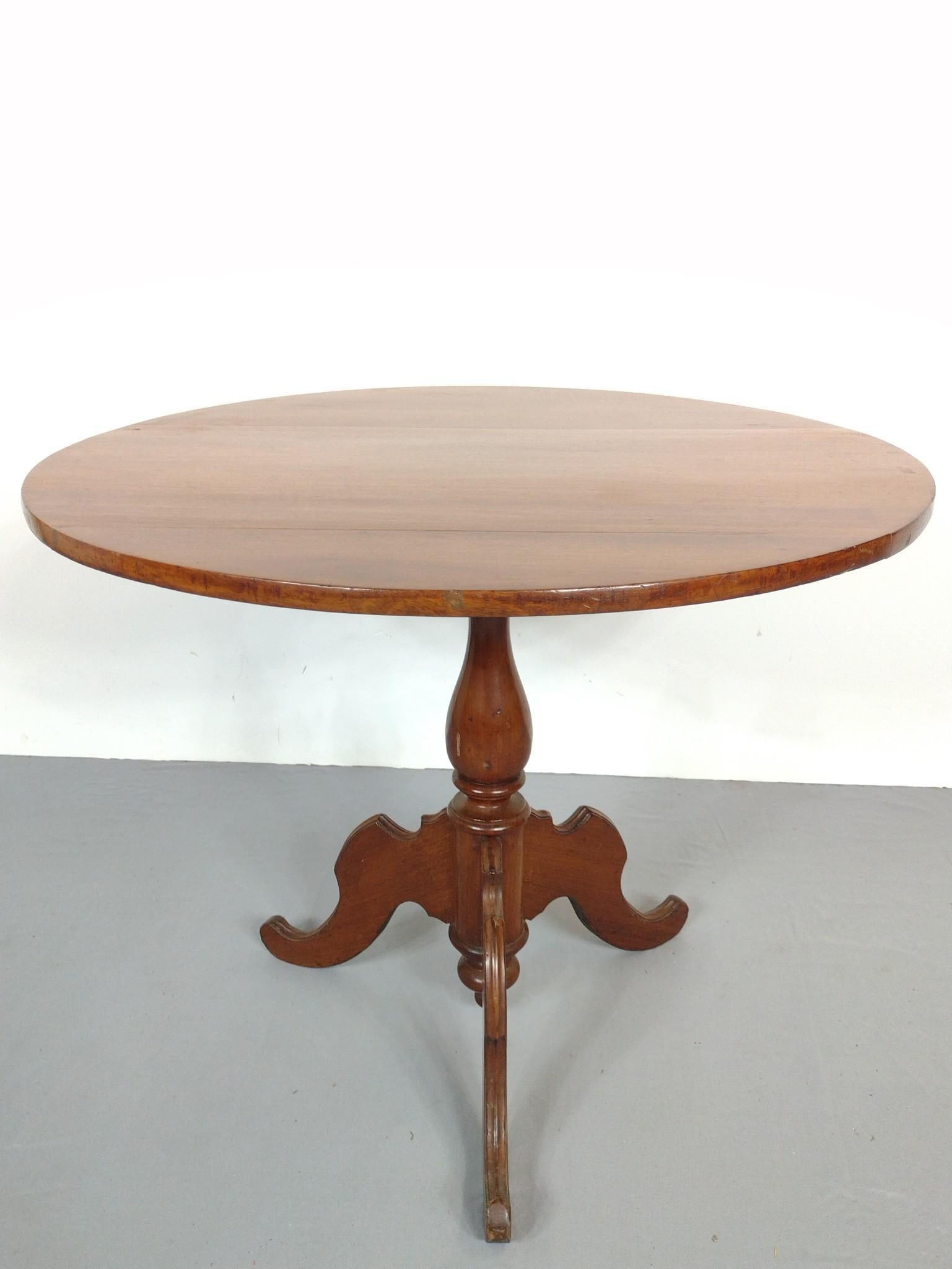 Tilt Top Table: 35" diameter X 28-3/4" high. Base has scratches. Top has split. MG.