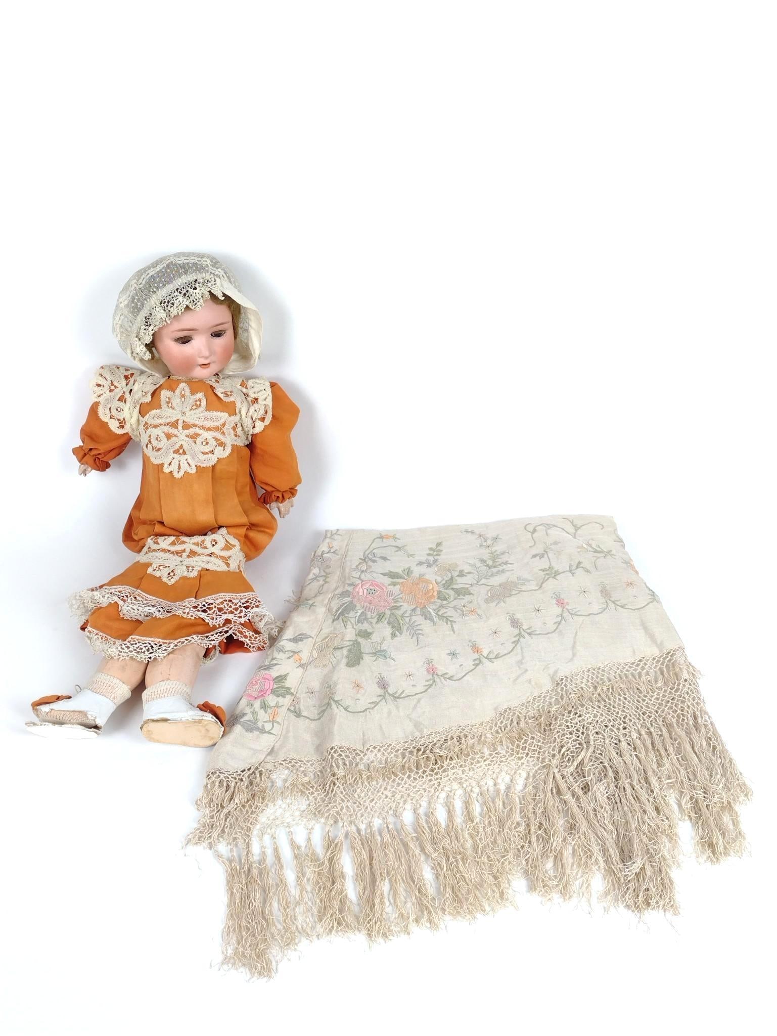 Piano Scarf and Shoenau & Hoffmaster Antique Doll: Scarf: 60" long. Some loss to fringe. Doll: Number 1909-5. Made in Germany. 25" high. Some discoloration to hands and legs. Peekaboo eyes. Some losses and tears to original shoes.