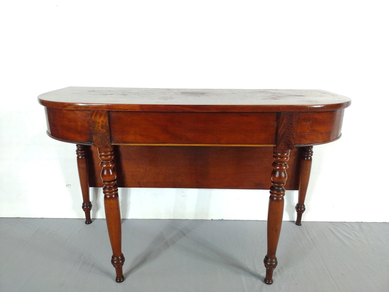 Antique Partial Banquet Table: 48" wide X 20-1/2" to 40-1/4" deep X 29" high. Has some scratches. Table top has some discoloring and finish loss. MG