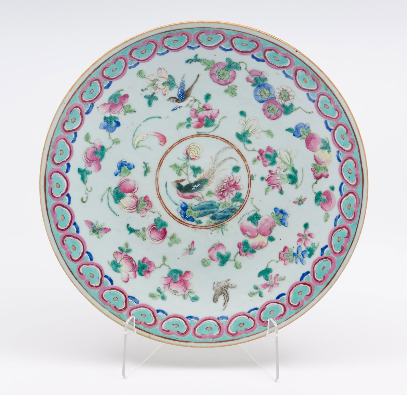 Canton Famille Rose Charger with Pheasant: DESCRIPTION: Canton Famille Rose charger. The center decorated with a pheasant and flowers of the four seasons along with birds and a butterfly. The rim with a ruyi motif. The base decorated with bam