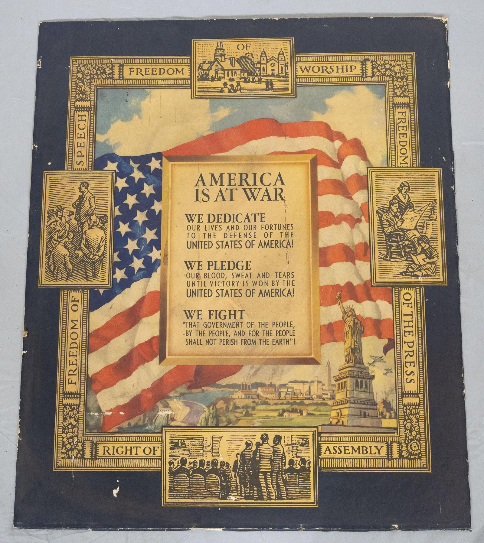 WWII American Propaganda Poster - 1st Amendment Freedoms: Cardboard poster titled "America is at War", with 1st Amendment freedoms and rights written along the edges. Wear to edges and corners of board, along with light scuffing to some parts. 29" high x 24"