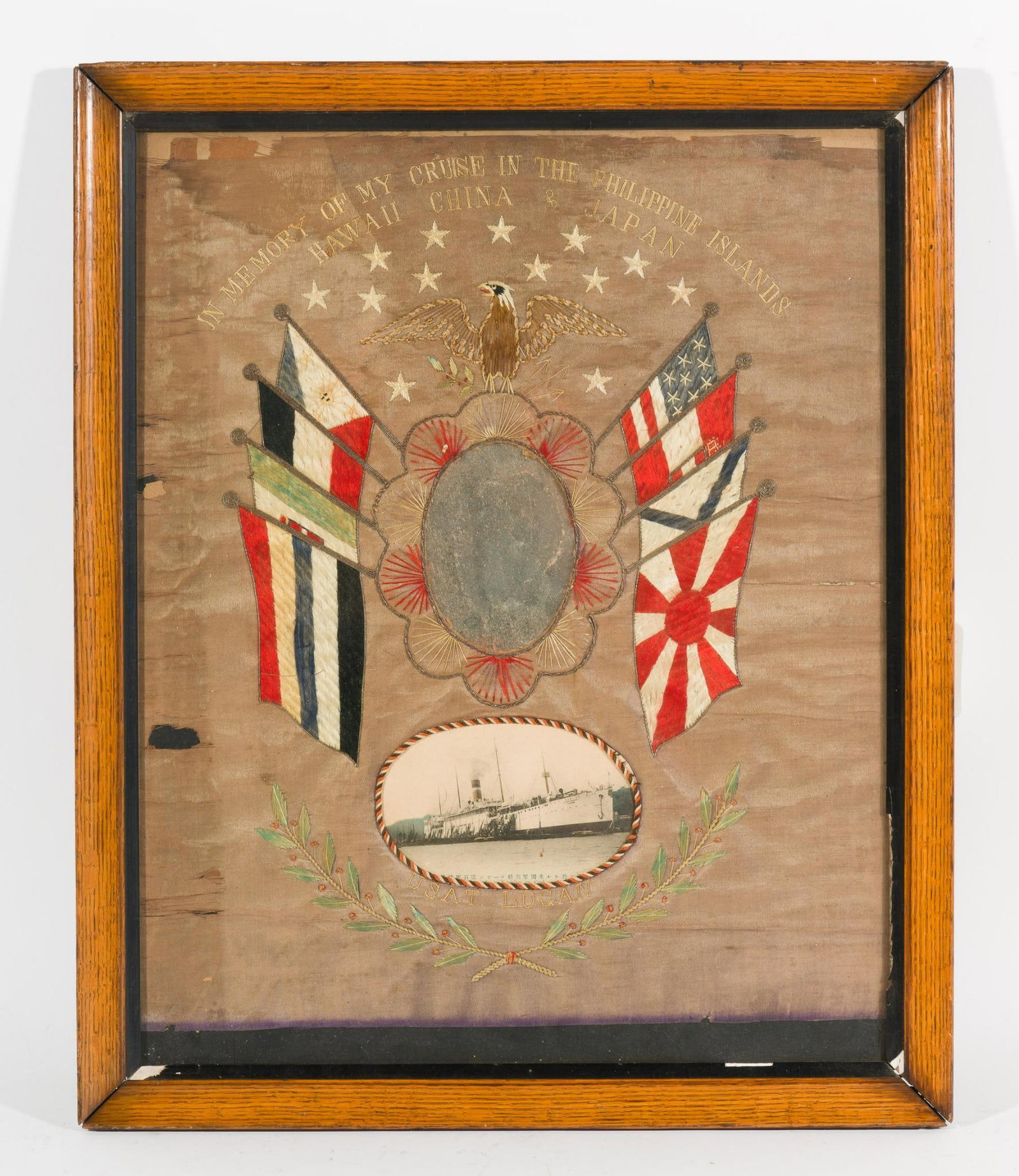 Early 1900s USAT Logan China Cruise Commemorative Flag In Frame: "My Cruise of the Philippine Islands, Hawaii, China and Japan." Commemorative flag of the Asiatic cruise of the transport ship USAT Logan. Includes space for soldier's face, along with a postcard inse