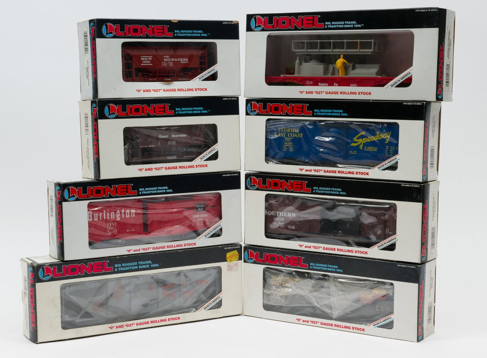 8 Pieces of Lionel O-Gauge Freight: All in original boxes. Includes Seaboard System Box Car, Southern Pacific Covered Hopper, Florida East Coast Box Car, Burlington Boxcar, Milwaukee Road Ore Car, Great Northern Ore Car with ore load, S