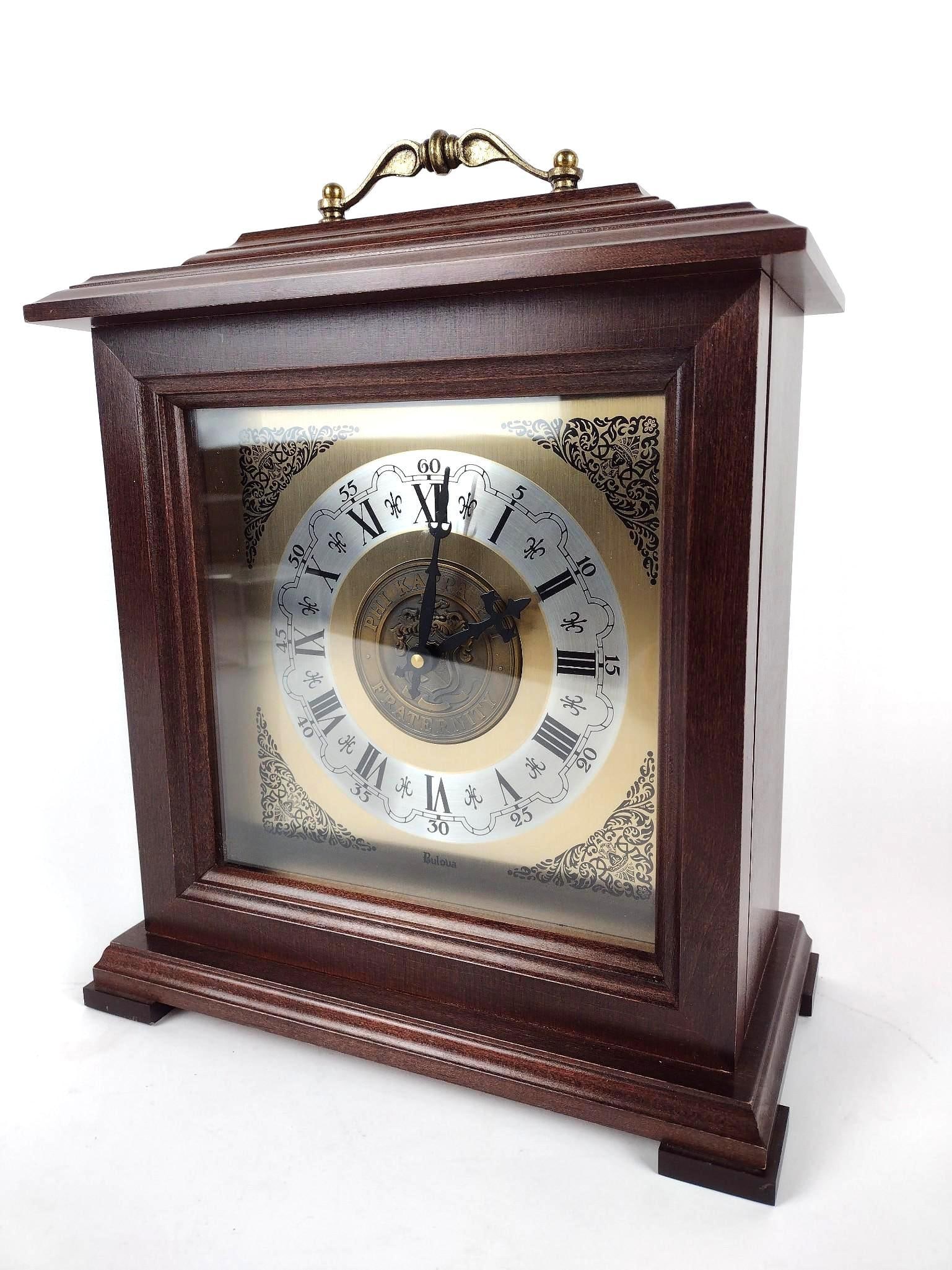 Bulova Fraternity Mantle Clock: Battery operated. 11-1/2" wide x 6" deep x 14-1/2" high.