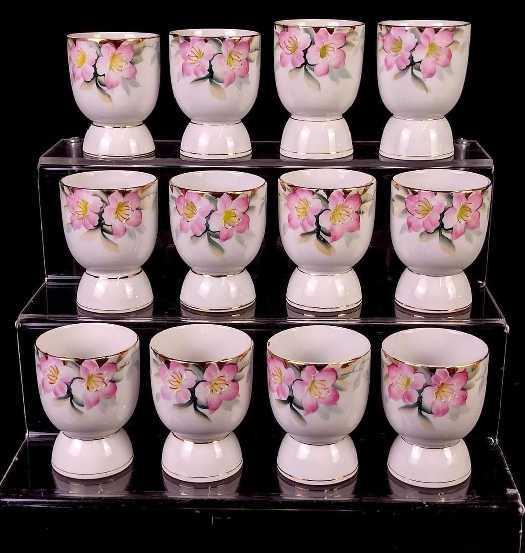 12 Noritake Azalea Egg Cups: All with red back stamp. Each 2-1/4" diameter x 3-1/2" high. Minor losses to gold paint.