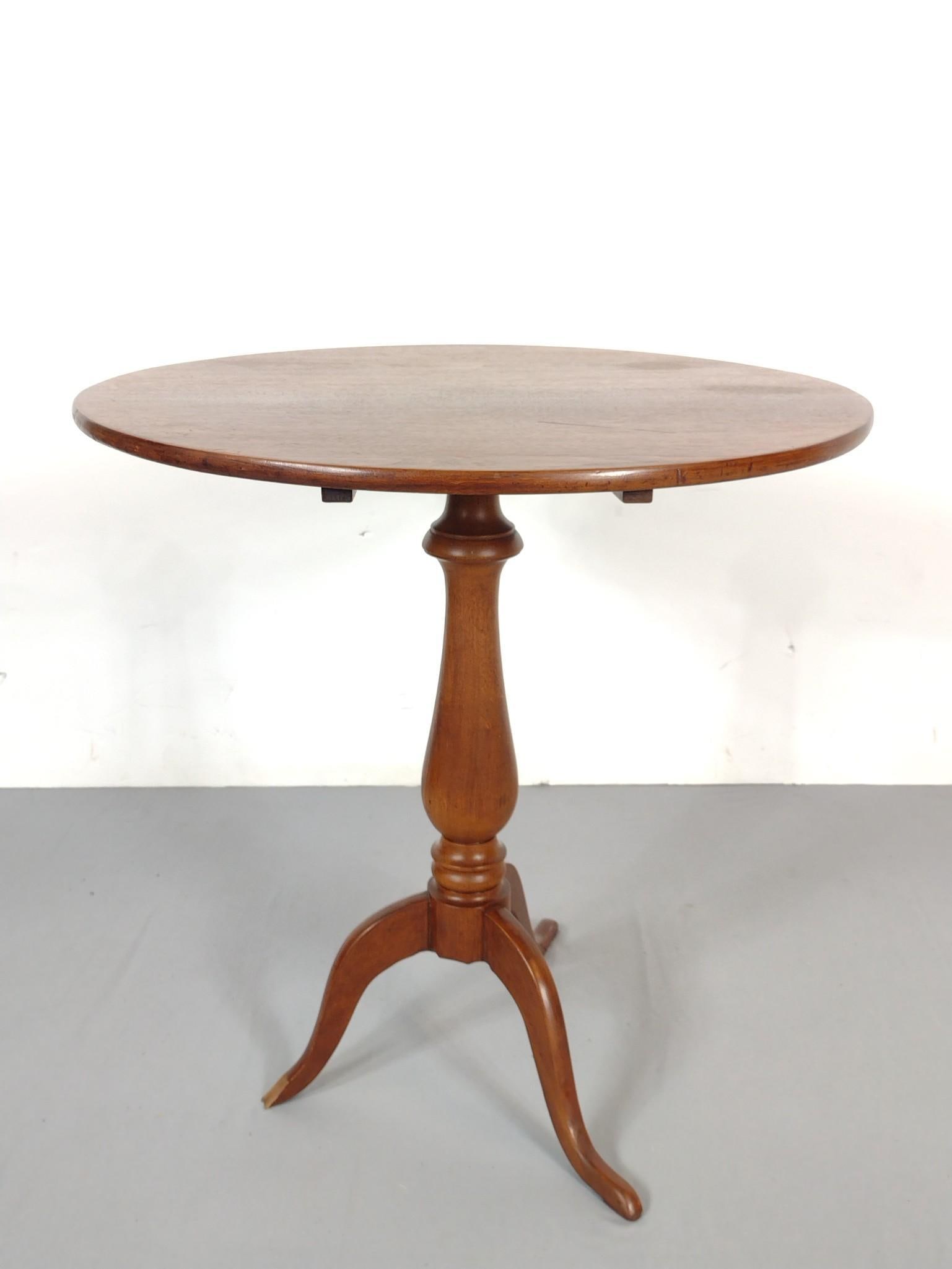 Tilt Top Table: 28-1/2" diameter X 29" high. One foot has loss. MG.