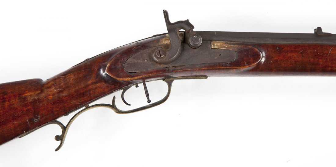 D. J. Gabriel Marked Kentucky Rifle - .36 Cal.: SERIAL #: None DESIGN: Percussion operated black powder single shot. 31-1/4" barrel. MATERIAL/FINISH COMPOSITION: Octagon barrel is browned metal. Brass mountings. Half length curly maple wood stock. 