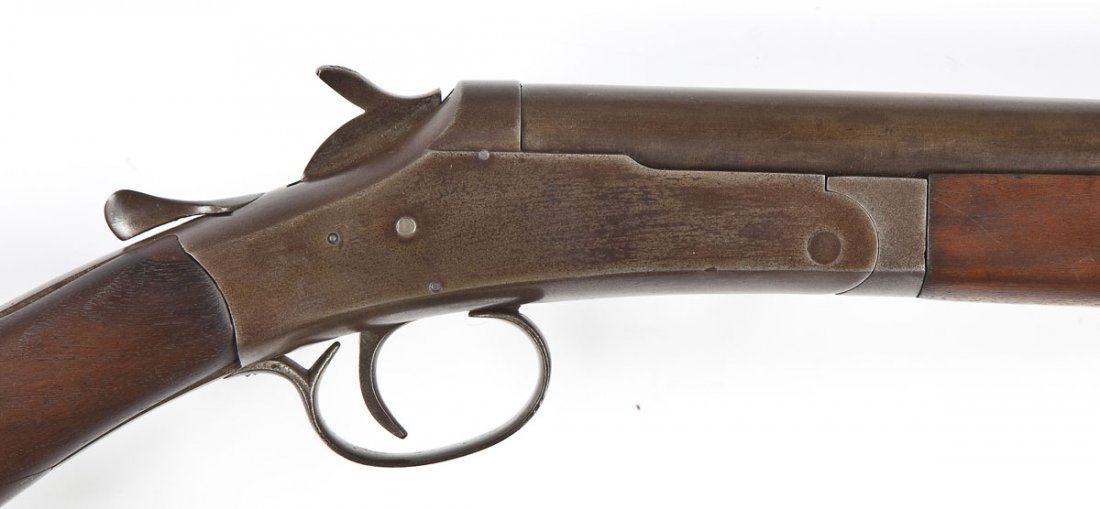 American Gun Co. Single Barrel Shotgun - 12 Ga.: SERIAL #: 560905 DESIGN: Break open. 28" improved cylinder barrel. MATERIAL/FINISH COMPOSITION: Blued steel. Wood pistol grip stock and forearm. Black plastic butt plate. FEATURES: Bead front sight. C