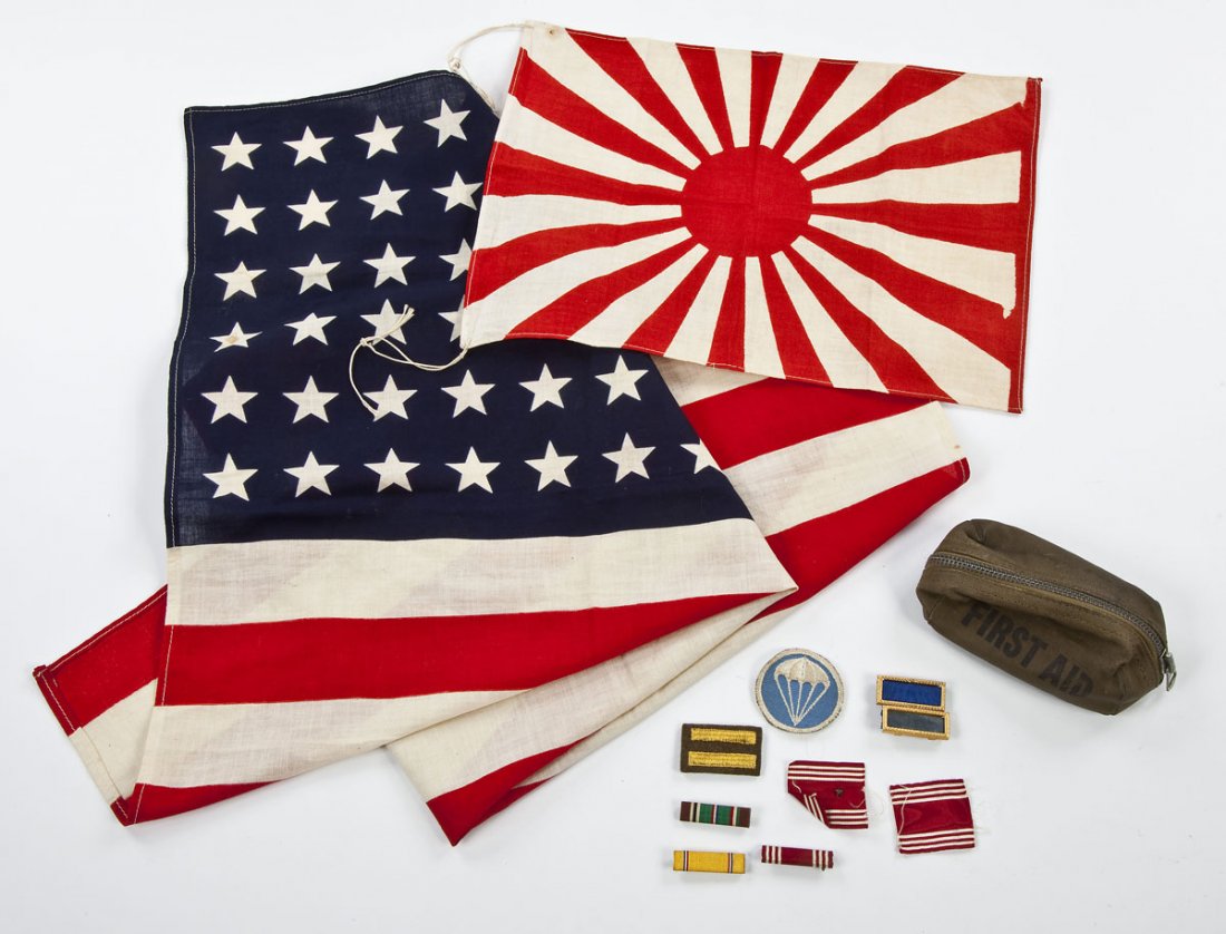 Lot of World War Military Items: DESCRIPTION: A lot consisting of a Japanese World War II small military flag, a 48 star American flag, and a group of American military ribbons and patches in a First Aid zippered pouch. MEASUREMENTS: