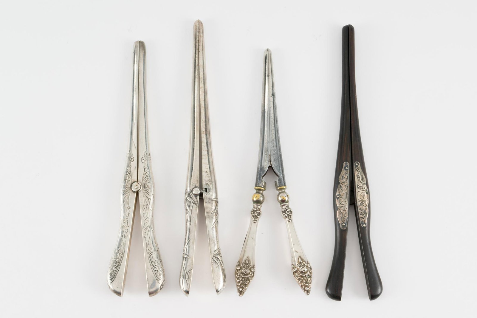 4 Glove Stretchers Incl Sterling: Includes ebony with sterling decoration, steel with sterling handles, and two marked sterling. 7" to 8" high. JS