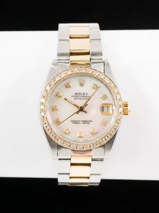 Rolex Oyster Perpetual Datejust Midsize Stainless and 14k Gold: A nice midsize Rolex Oyster Perpetual Datejust with aftermarket diamond bezel and mother of pearl diamond dial. Watch model 6827 manufactured in 1979. On a 14k and stainless Oyster bracelet also datin