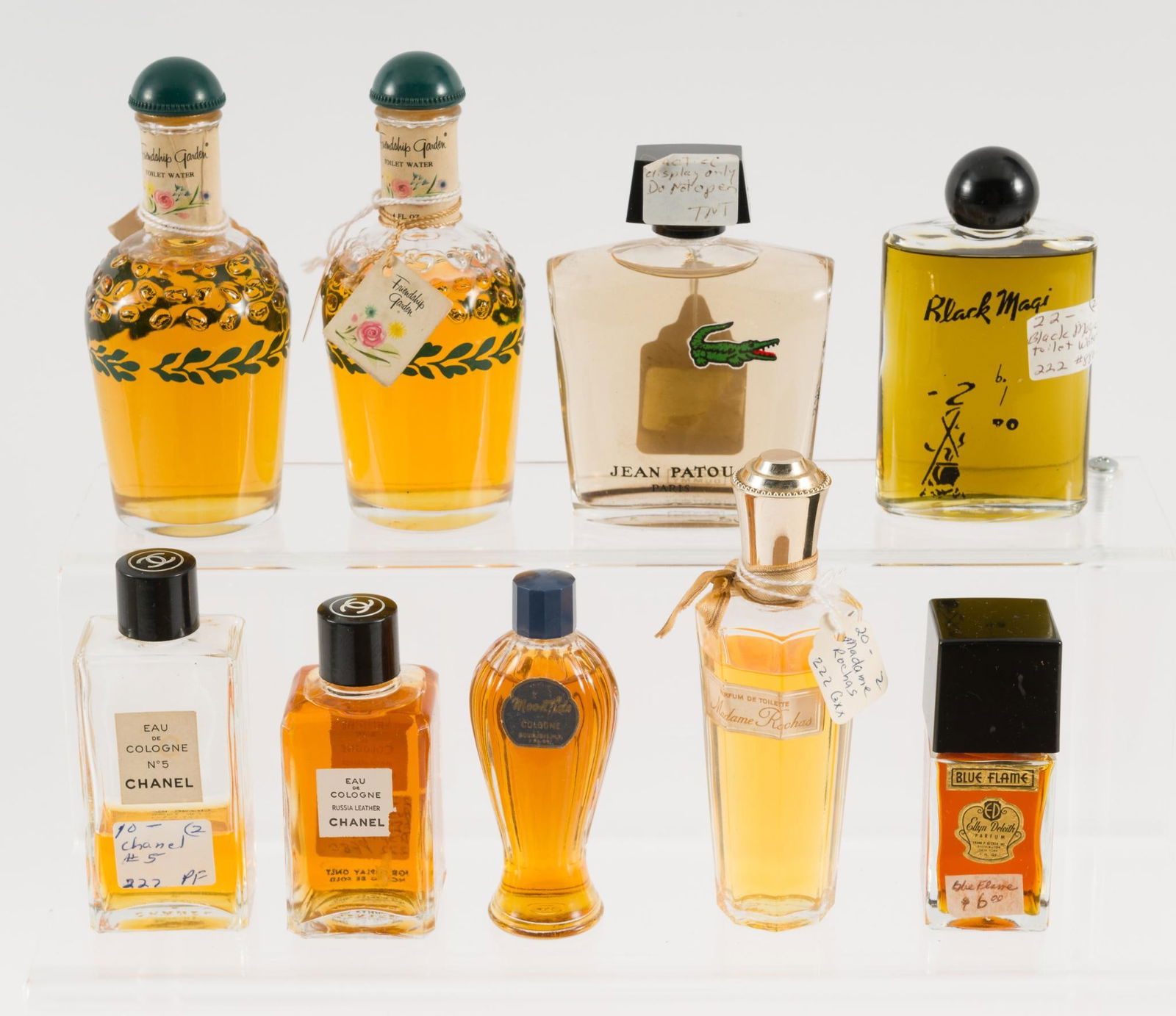 9 Bottles of Perfume: Includes: Chanel, Jean Patou, Blue Flame, and more. 1-1/2" to 2-3/4" wide x 3-1/2" to 5" high. JS