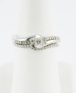 10k White Gold & .50 CTW Diamond Wedding Set: Marked 10k white gold engagement ring and band. Engagement ring set with three princess cut diamonds accented by round cut diamonds. Fitted band set with round cut diamonds. 4.2 grams. Both size 7.