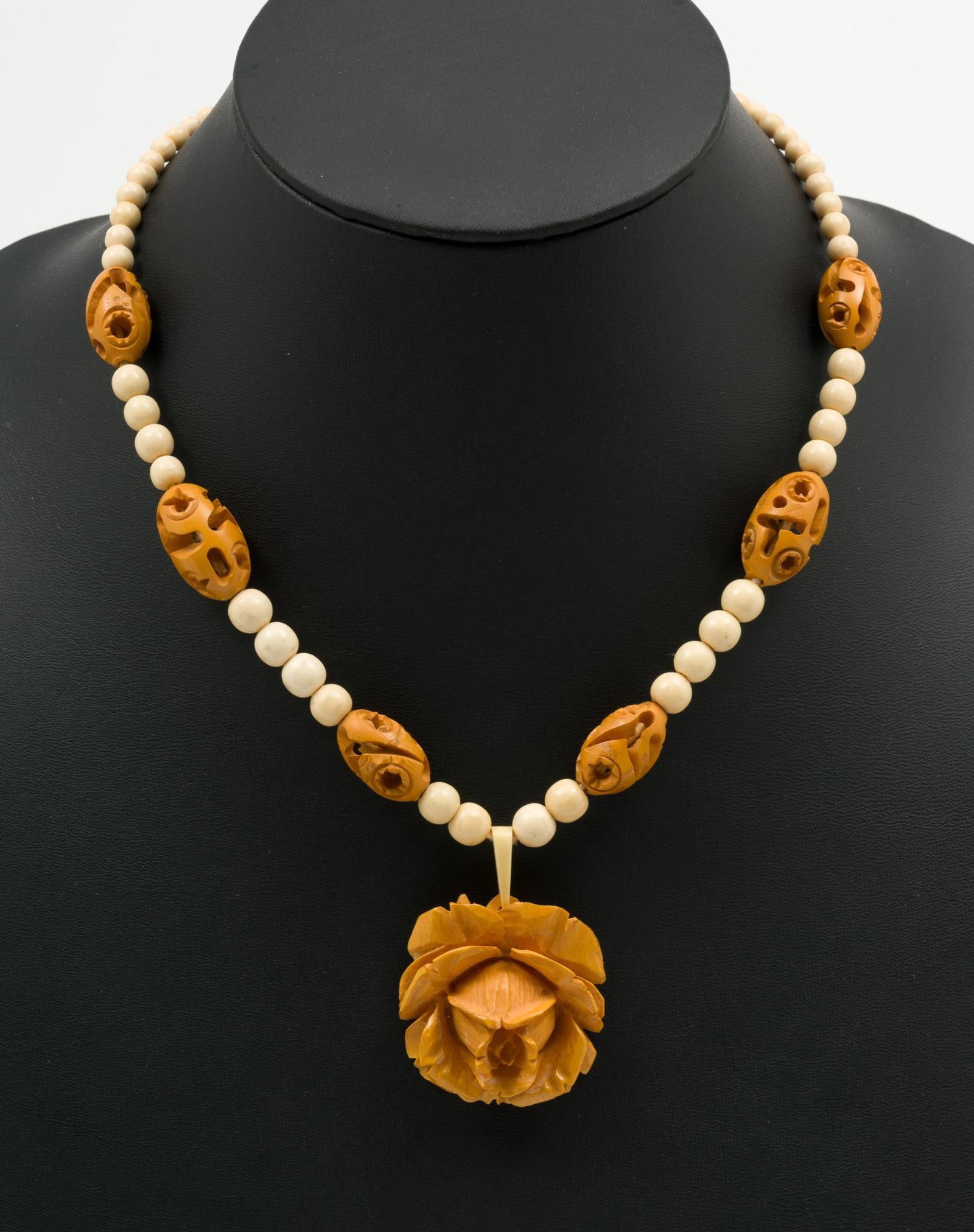 Carved Bone & Wood Rose Necklace: Necklace 17" long. Pendant 1-3/8" high. AJ.