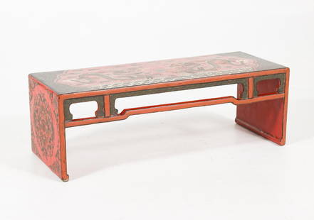 Chinese Red Lacquered & Hand-Painted Kang Table: Kang red lacquered hand painted sea drawings to top. Medallions to side open work skirt. Late 19th to early 20th century. 37-1/2" wide x 12-1/2" high x 14" deep. Wear and lifting to lacquer. MEG/DC