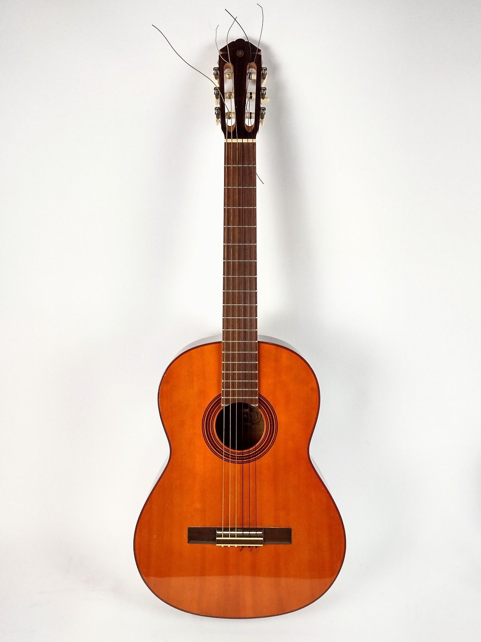Yamaha G-55A Acoustic Guitar: Case included. Body 19" long. Overall 39-1/4" long. Strings have been re-strung. Some wear to guitar and case.