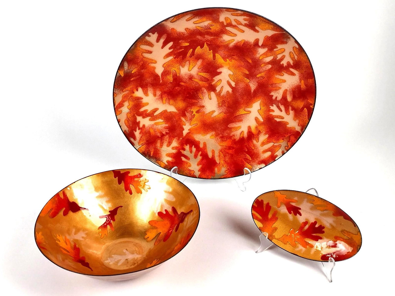 3 Mackintosh Enameled Metal Bowls: All with orange leaf pattern. 7-1/2" to 15" wide X 1/2" to 4" high.