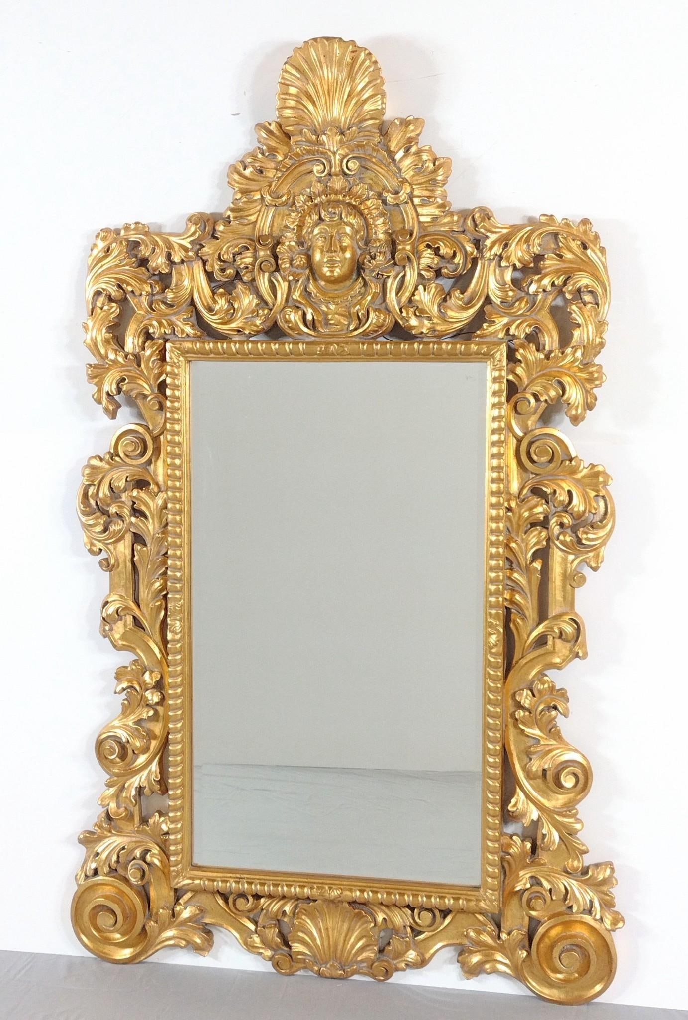 Oversized Gilt Figural Mirror: Overall with frame 81" high X 48" wide. Minor paint losses.