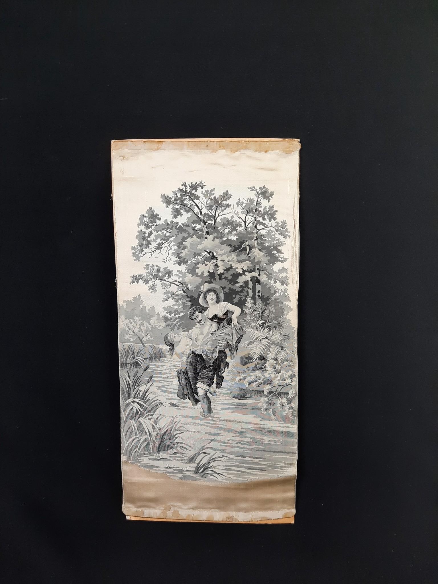 Figural Embroidery on Silk: Cut fragment. Overall 15" high x 7" wide. Minor fraying and discoloration around edges.