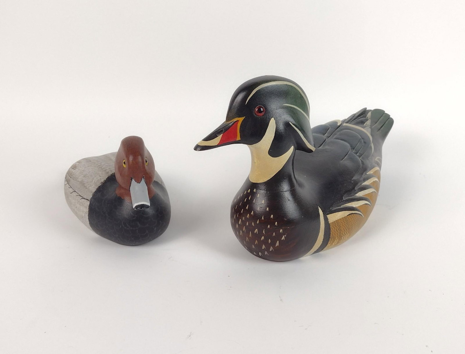 2 Wood Duck Decoys incl Nina Kersteller: Also includes Ducks Unlimited 1986-1987. 10-1/2" to 15" long x 5" to 7-3/4" high. LR