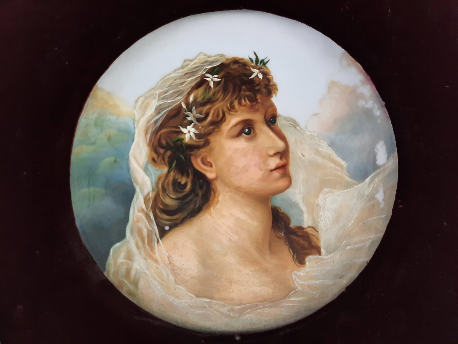 Hand Painted Figural Plaque in Ornate Frame: Sight 13-1/2" diameter. Overall with frame 28" high x 28" wide. Some repairs, losses and cracks to frame.