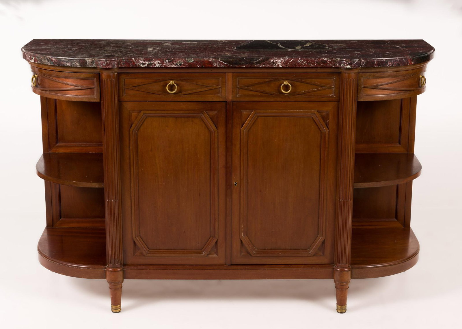 French Charles X Buffet: Fine fruit woods and marble French Charles X buffet probably late 19th or early 20th century. The tapered legs with brass castors support a Demilune case with conforming drawers and doors that open to