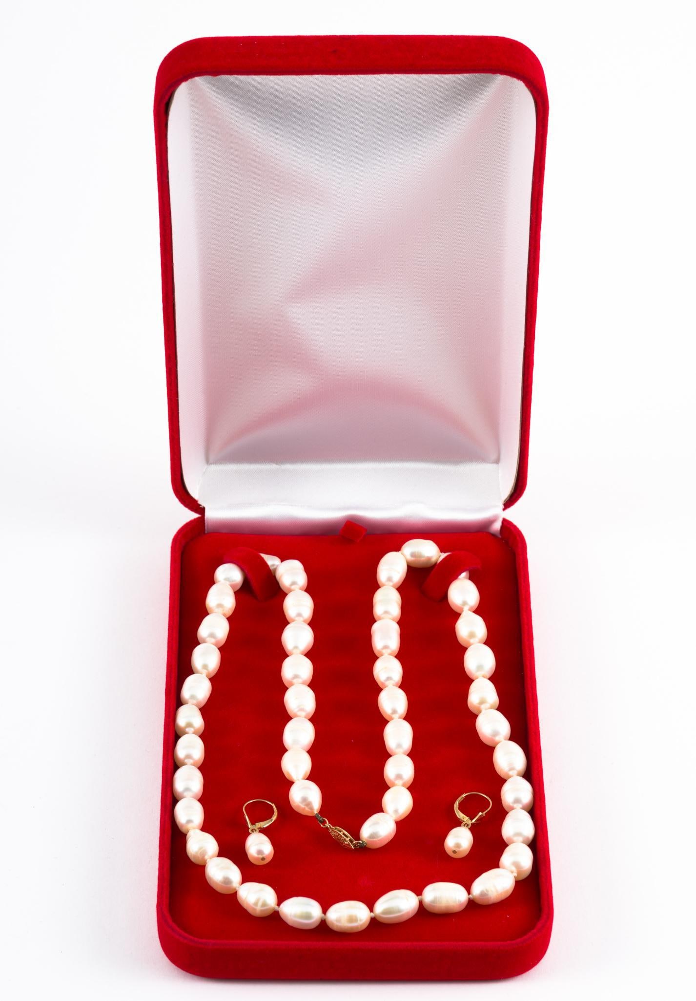 Pearl and 14K Gold Necklace &; Earrings: Pearl necklace and earrings each with marked 14k gold. Necklace 25" long, pearls 8.9-9.7mm each. Earrings 1-1/8" high, pearls 7.7mm wide.