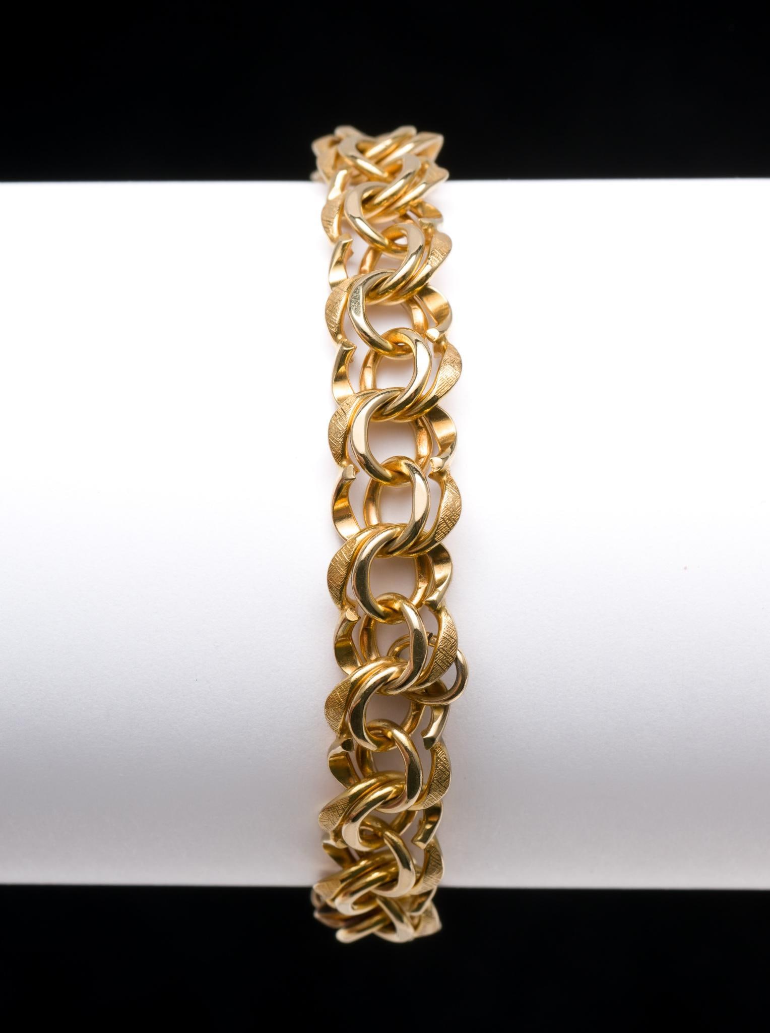 14k Gold Charm Bracelet: Marked 14k. 22 grams. 1/2" wide x 7-3/4" long. MEG