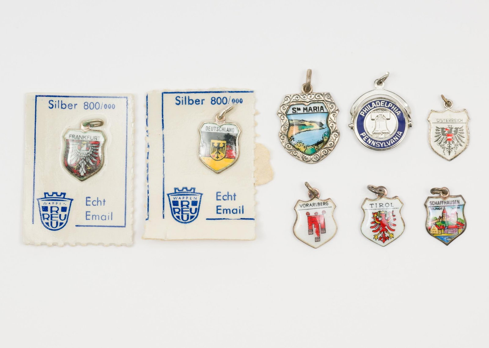 8 Assorted Sterling Souvenir Charms: Includes Santa Maria, Vorarlberg, Tyrol, Philadelphia, Schaffhausen, Frankfurt, Austria, and Germany.