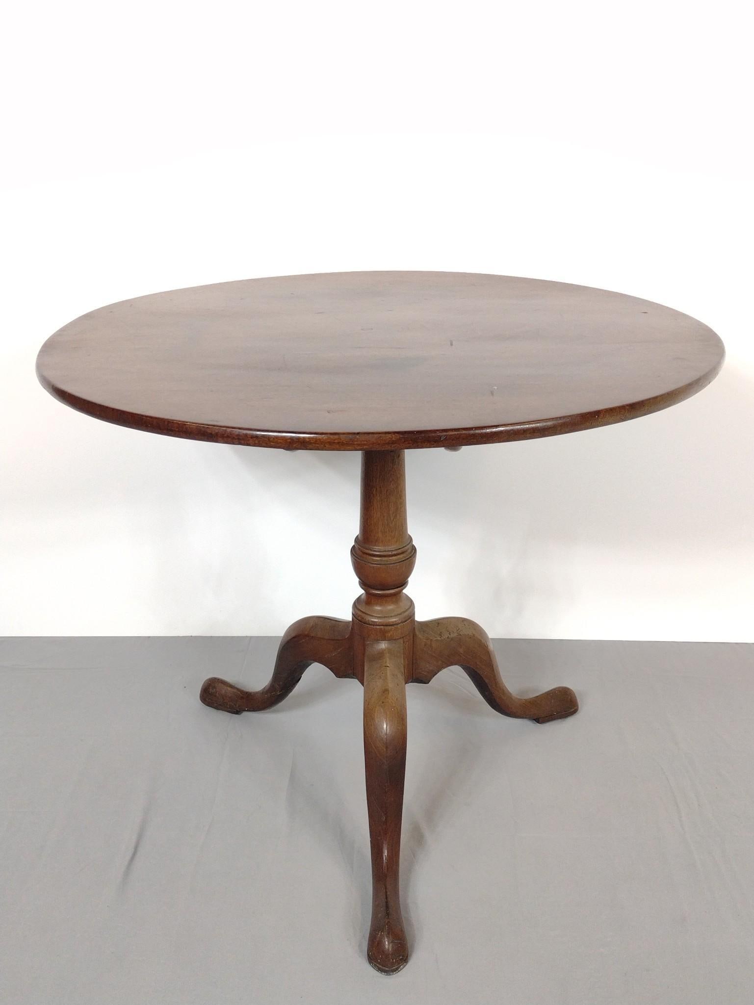 Tilt Top Table: NOT ELIGIBLE FOR IN-HOUSE SHIPPING. 34" diameter X 29-1/2" high. Top has some discoloring. Base has some sun fading. MG.